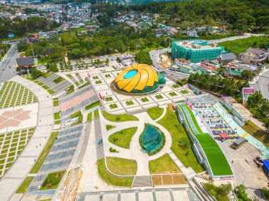 Top view of Lam Vien square at the bank of Xuan Huong Lake. In Vietnam, Da Lat is a popular destination attracting thousands of tourists. Urban development texture, green parks and city lake.