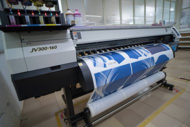 Ba Ria, VIETNAM - OCT 20, 2022 : Interior factory Large printing machine for paper business in printing room. Sublimation concept.