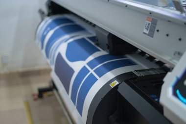 Interior factory Large printing machine for paper business in printing room. Sublimation concept.