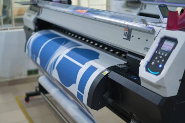 Ba Ria, VIETNAM - OCT 20, 2022 : Interior factory Large printing machine for paper business in printing room. Sublimation concept.