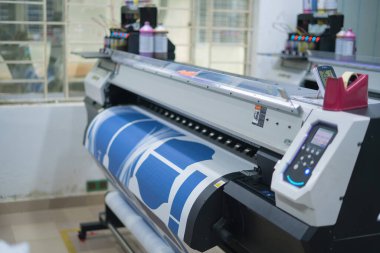 Ba Ria, VIETNAM - OCT 20, 2022 : Interior factory Large printing machine for paper business in printing room. Sublimation concept.