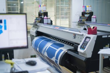 Ba Ria, VIETNAM - OCT 20, 2022 : Interior factory Large printing machine for paper business in printing room. Sublimation concept.