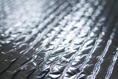 Close up Silver foil insulation texture background. Silver insulation, sound insulation and heat