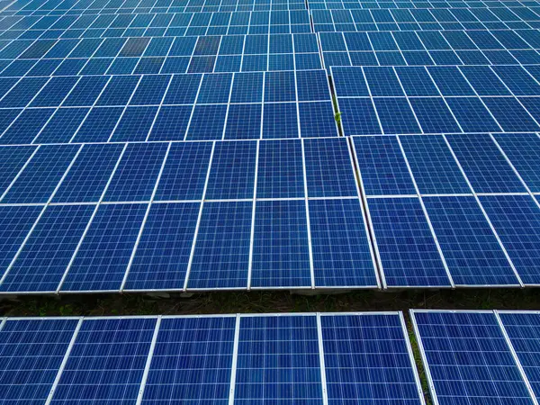 Top view of Solar panels on farm. Alternative source of electricity. solar panels absorb sunlight as a source of energy to generate electricity creating sustainable energy