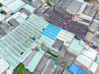 Top view fisherman in fishing village.They was drying fresh fish on a wooden grid for the market. Traditional dried Blue scaled herring fish drying on racks. Lifestyle concept.