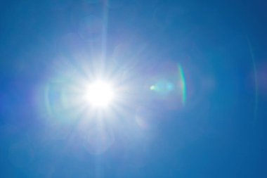 Background cloud summer. Cloud summer. Sky cloud clear. Natural sky beautiful blue and white texture background with sun rays shine. Scenic orange sunset sky background. digital lens flare