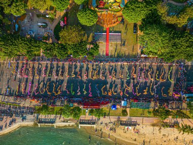 Vung Ta, VIETNAM JAN 1 2023: Top view of dragon dance perform celebration new year. Group of people perform a traditional lion dance and dragon dance.