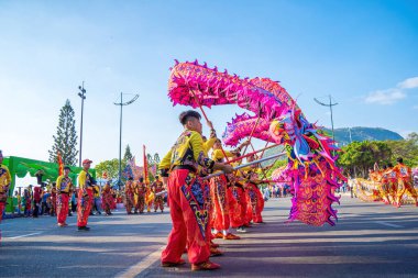 Vung Tau, VIETNAM - JAN 1 2023: Lion and dragon dance perform celebration new year. Group of people perform a traditional lion dance and dragon dance.