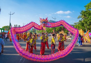 Vung Tau, VIETNAM - JAN 1 2023: Lion and dragon dance perform celebration new year. Group of people perform a traditional lion dance and dragon dance.