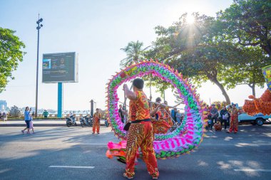 Vung Tau, VIETNAM - JAN 1 2023: Lion and dragon dance perform celebration new year. Group of people perform a traditional lion dance and dragon dance.