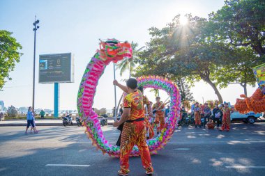 Vung Tau, VIETNAM - JAN 1 2023: Lion and dragon dance perform celebration new year. Group of people perform a traditional lion dance and dragon dance.