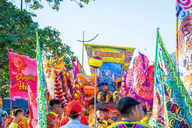 Vung Tau, VIETNAM - JAN 1 2023: Lion and dragon dance perform celebration new year. Group of people perform a traditional lion dance and dragon dance.