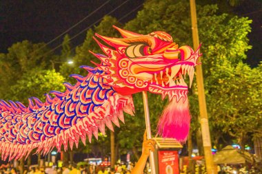 Lion and dragon dance perform celebration new year. Group of people perform a traditional lion dance and dragon dance.