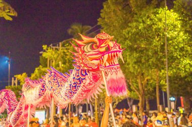 Lion and dragon dance perform celebration new year. Group of people perform a traditional lion dance and dragon dance.