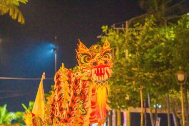 Lion and dragon dance perform celebration new year. Group of people perform a traditional lion dance and dragon dance.