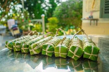 Vietnamese Sticky Rice Cake (tet cake), Vietnamese traditional new year food. the most important food of Vietnamese lunar new year Tet. Focus bundle of tet cake with blurred background