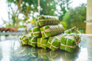 Vietnamese Sticky Rice Cake (tet cake), Vietnamese traditional new year food. the most important food of Vietnamese lunar new year Tet. Focus bundle of tet cake with blurred background
