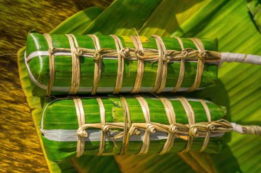 Vietnamese Sticky Rice Cake (tet cake), Vietnamese traditional new year food. the most important food of Vietnamese lunar new year Tet. Focus bundle of tet cake with blurred background