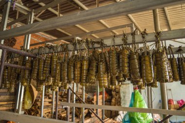 Focus Vietnamese Sticky Rice Cake (tet cake) hang in shelves after hard-boiled, Vietnamese traditional new year food. the most important food of Vietnamese lunar new year Tet.
