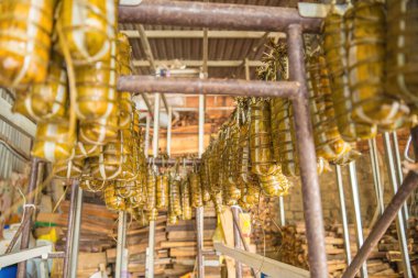 Focus Vietnamese Sticky Rice Cake (tet cake) hang in shelves after hard-boiled, Vietnamese traditional new year food. the most important food of Vietnamese lunar new year Tet.