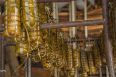 Focus Vietnamese Sticky Rice Cake (tet cake) hang in shelves after hard-boiled, Vietnamese traditional new year food. the most important food of Vietnamese lunar new year Tet.