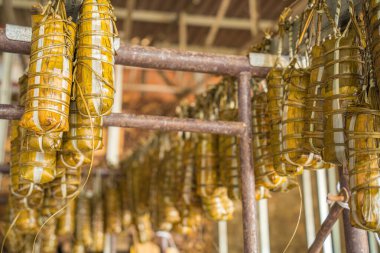 Focus Vietnamese Sticky Rice Cake (tet cake) hang in shelves after hard-boiled, Vietnamese traditional new year food. the most important food of Vietnamese lunar new year Tet.