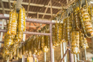 Focus Vietnamese Sticky Rice Cake (tet cake) hang in shelves after hard-boiled, Vietnamese traditional new year food. the most important food of Vietnamese lunar new year Tet.