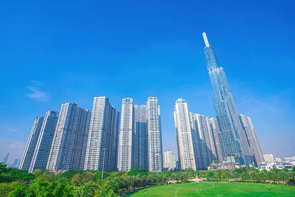 Aerial morning view with sunny and green trees at Landmark 81 - it is a super tall skyscraper with development buildings along Saigon river in Ho Chi Minh city, Vietnam. Business, travel concept.