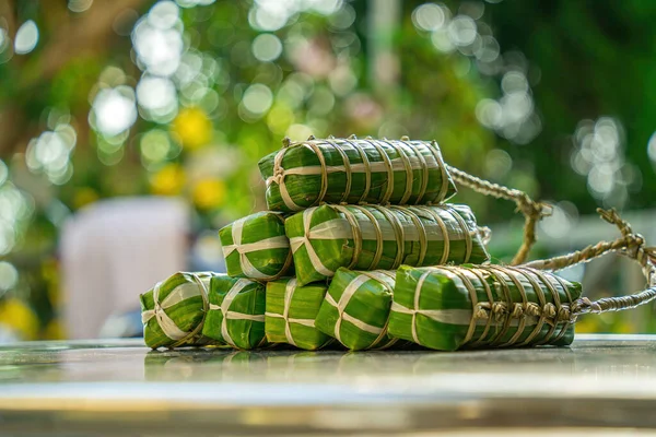 Vietnamese Sticky Rice Cake (tet cake), Vietnamese traditional new year food. the most important food of Vietnamese lunar new year Tet. Focus bundle of tet cake with blurred background