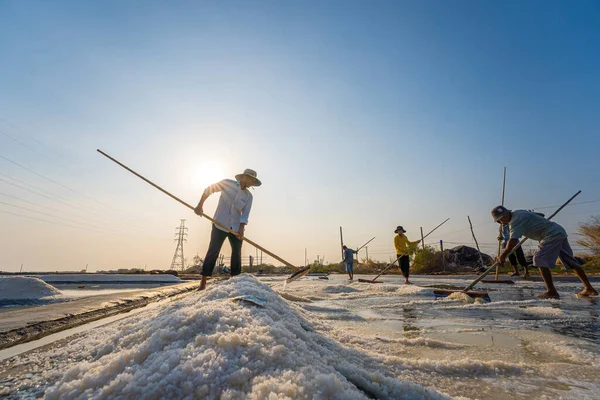 stock image Vung Tau, VIETNAM - FEB 25 2023: Sea salt process made from pile of salt in the salt pan by salt worker at rural area of Long Dien. Salt fields is one of the most unique destinations in Viet Nam