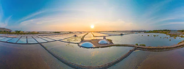 Aerial drone view of Salt Fields in Long Dien, the largest sea-salt producer in Vung Tau, and its operations are based on a thousand-year tradition of sea-salt production on Long Dien downtown
