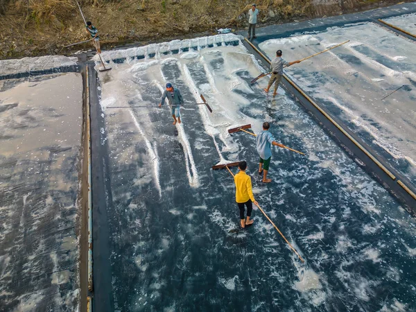 stock image Sea salt process made from pile of salt in the salt pan by salt worker at rural area of Long Dien, Ba Ria Vung Tau. Salt fields is one of the most unique destinations in Viet Nam