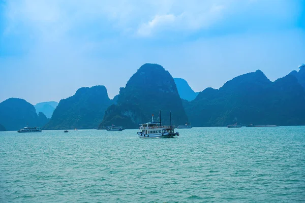 stock image Scenic view of rock island in HaLong Bay, Vietnam, Southeast Asia. UNESCO World Heritage Site. Mountain islands at Ha Long Bay. Beautiful landscape Popular asian landmark famous destination of Vietnam