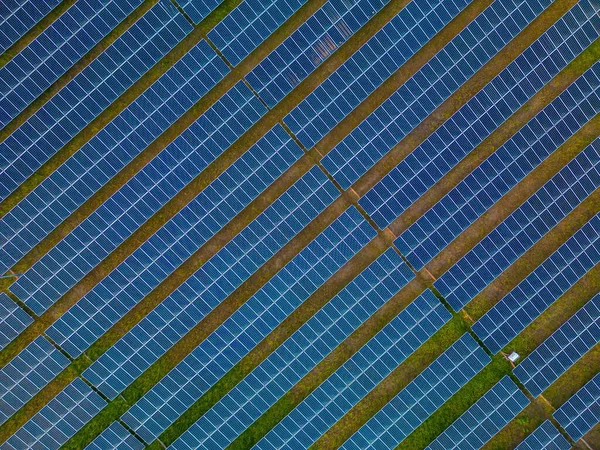 stock image Top view of Solar panels on farm. Alternative source of electricity. solar panels absorb sunlight as a source of energy to generate electricity creating sustainable energy. Eco concept