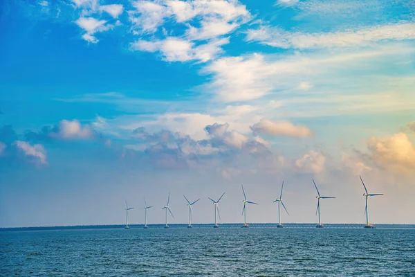 stock image Panoramic view of wind farm at sea, with high wind turbines for generation electricity with copy space at Tra Vinh, Viet Nam. Green energy concept. Eco concpept