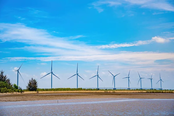 stock image Panoramic view of wind farm at sea, with high wind turbines for generation electricity with copy space at Tra Vinh, Viet Nam. Green energy concept. Eco concpept