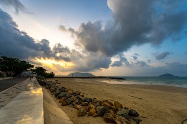 Calm sea with sunset sky and sun through the clouds over. Calm sea with sunset sky and sun through the clouds over. Meditation ocean and sky background. Tranquil seascape. Horizon over the water.