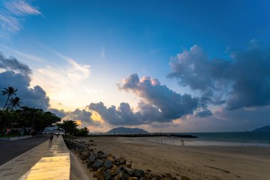 Calm sea with sunset sky and sun through the clouds over. Calm sea with sunset sky and sun through the clouds over. Meditation ocean and sky background. Tranquil seascape. Horizon over the water.