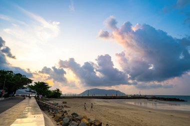 Calm sea with sunset sky and sun through the clouds over. Calm sea with sunset sky and sun through the clouds over. Meditation ocean and sky background. Tranquil seascape. Horizon over the water.