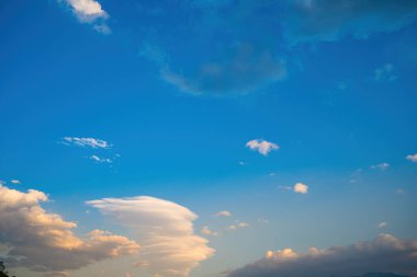 Beautiful view of blue sky with clouds at sunrise. Partly cloudy.Background cloud summer. Cloud summer. Sky cloud clear with sunset. Natural sky cinematic beautiful yellow and white texture background