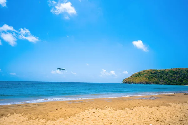 stock image Beautiful Dam Trau beach in Con Dao island. Bottom view Airplane is landing. Wild beach Con Dao island from above with blue sea and mountain, so many cloud.