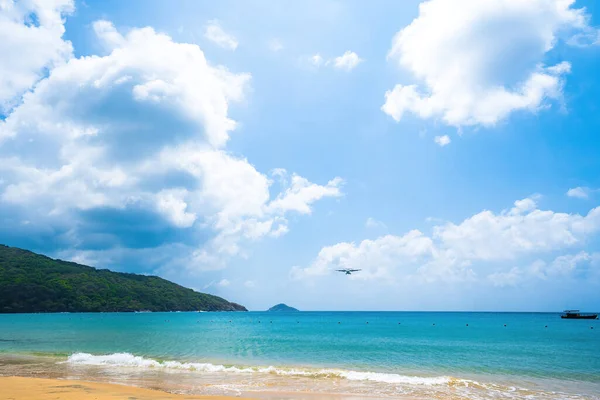 stock image Beautiful Dam Trau beach in Con Dao island. Bottom view Airplane is landing. Wild beach Con Dao island from above with blue sea and mountain, so many cloud.