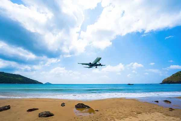 stock image Beautiful Dam Trau beach in Con Dao island. Bottom view Airplane is landing. Wild beach Con Dao island from above with blue sea and mountain, so many cloud.