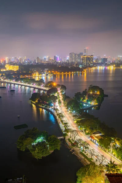 stock image Aerial view of Hanoi skyline cityscape at sunset time. Tran Quoc Pagoda,the oldest Buddhist temple in Hanoi, is located on a small island near the southeastern shore of Hanoi's West Lake, Vietnam.