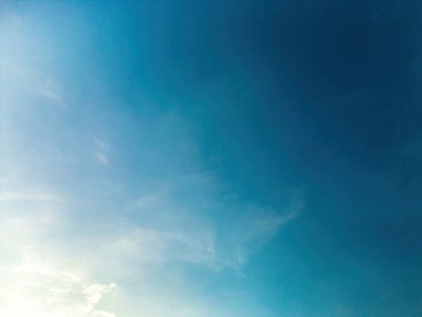 Beautiful view of blue sky with clouds at sunrise. Partly cloudy.Background cloud summer. Cloud summer. Sky cloud clear with sunset. Natural sky cinematic beautiful yellow and white texture background