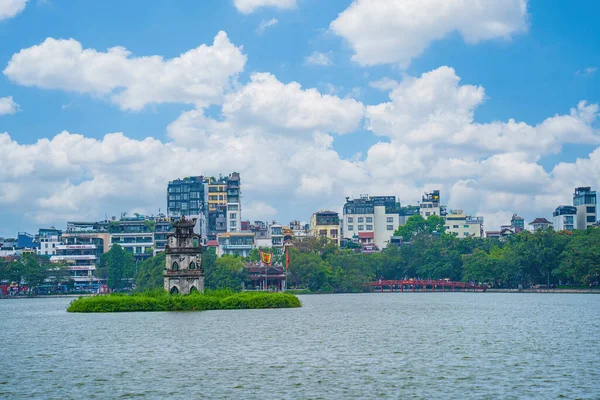 stock image Hoan Kiem Lake ( Ho Guom) or Sword lake in the center of Hanoi and Red Bridge or call by name The Huc. Hoan Kiem Lake is a famous tourist place in Hanoi. Travel and landscape concept.