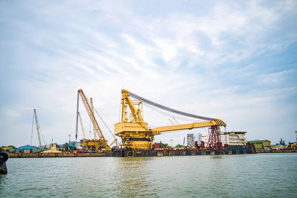 stock image Big boat crane to load containers, this is Cai Mep Port the big harbor for trade service industry, oil extraction ship.