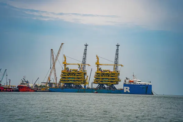 stock image Big boat crane to load containers, this is Cai Mep Port the big harbor for trade service industry, oil extraction ship.