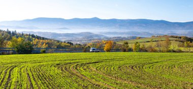 road in Kaczawskie mountains with Karkonosze view  during autumn in Poland clipart