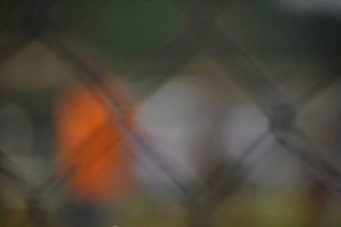 abstract background with bokeh of a fence with lights 